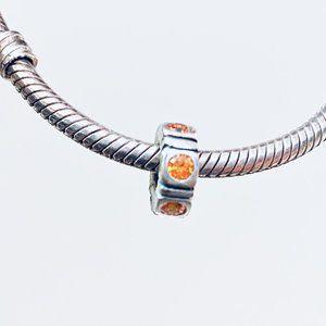 PANDORA STERLING SILVER ORANGE CZ TRINITY SPACER